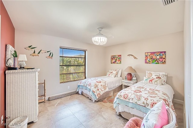 bedroom with light tile patterned floors, visible vents, and baseboards