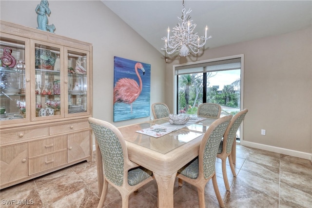 dining room with vaulted ceiling, baseboards, and a notable chandelier