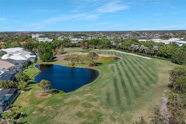 birds eye view of property with view of golf course and a water view