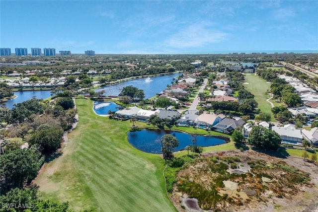 aerial view featuring golf course view and a water view