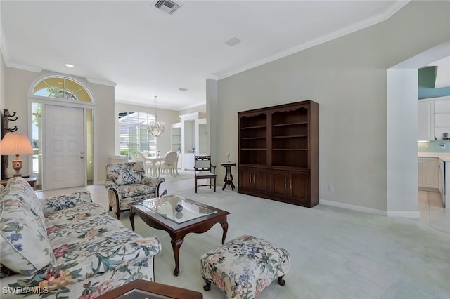 living area with visible vents, baseboards, ornamental molding, light carpet, and an inviting chandelier