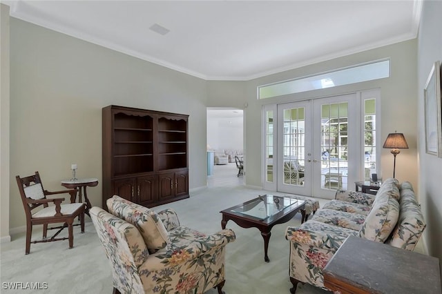 living room featuring carpet flooring, french doors, baseboards, and ornamental molding