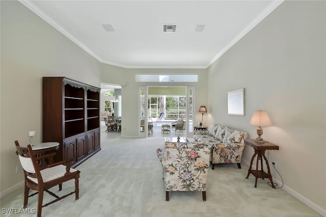 living area with visible vents, baseboards, light colored carpet, and crown molding