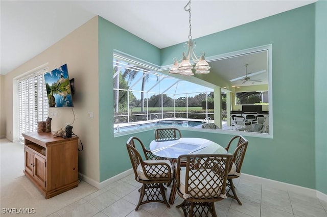 dining space featuring baseboards, light tile patterned flooring, and a sunroom