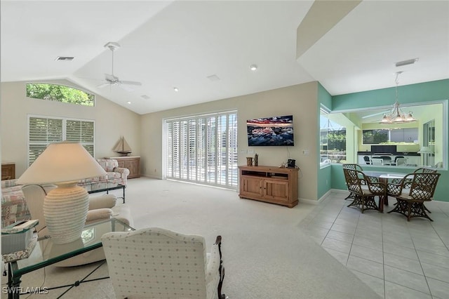 tiled living room featuring visible vents, carpet floors, ceiling fan with notable chandelier, and vaulted ceiling