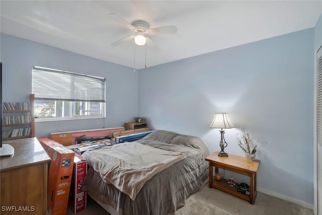 carpeted bedroom with a ceiling fan