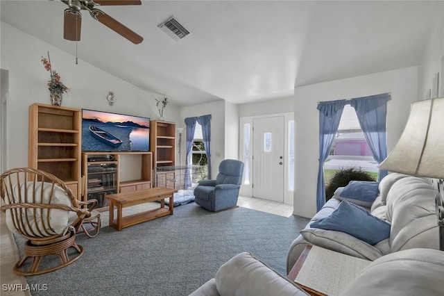 carpeted living room featuring lofted ceiling, ceiling fan, and visible vents