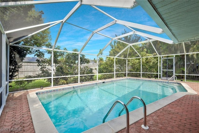 view of swimming pool featuring a patio, a lanai, and a fenced in pool