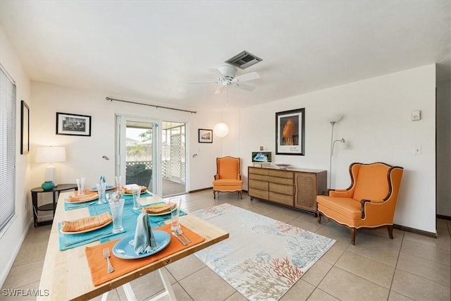 569 98th Ave N, Naples, FL 34108 - living area with light tile patterned flooring, baseboards, and a ceiling fan