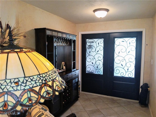 tiled entrance foyer with french doors