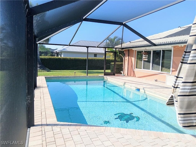 view of pool with a lanai, a fenced in pool, and a patio