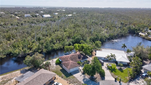 aerial view featuring a water view and a view of trees