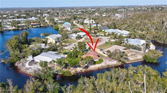 aerial view featuring a water view and a residential view