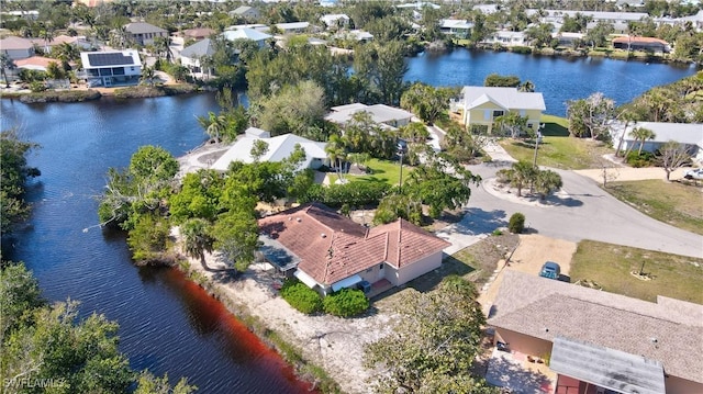 bird's eye view with a water view and a residential view