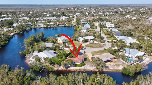 bird's eye view featuring a residential view and a water view