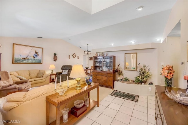 living room featuring light tile patterned floors, a chandelier, and vaulted ceiling