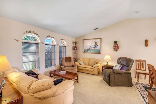 living area with visible vents, light carpet, and lofted ceiling