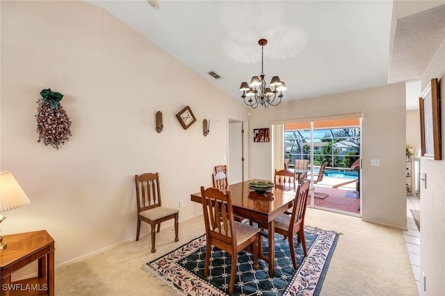 dining room with visible vents, baseboards, light colored carpet, and a notable chandelier