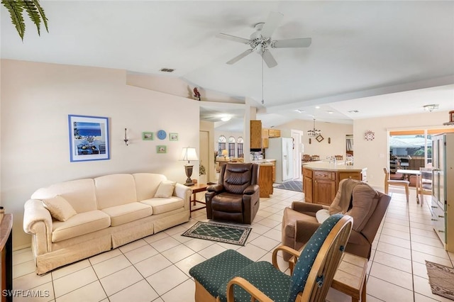 living area with light tile patterned floors, visible vents, a ceiling fan, and lofted ceiling