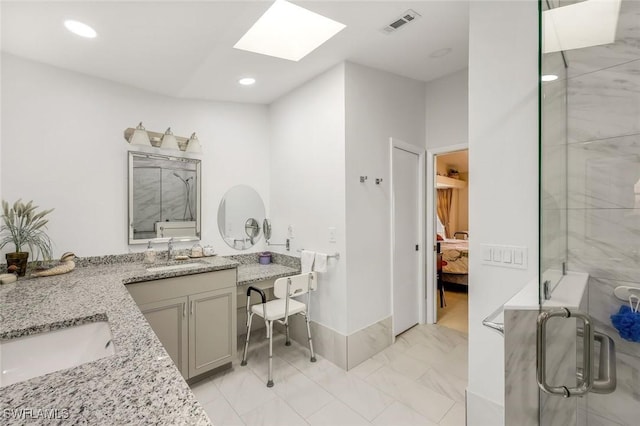 full bathroom featuring visible vents, a stall shower, ensuite bathroom, marble finish floor, and vanity