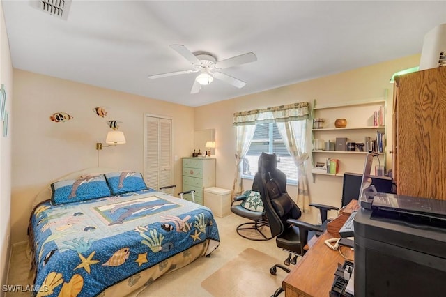 bedroom with a closet, visible vents, carpet, and a ceiling fan