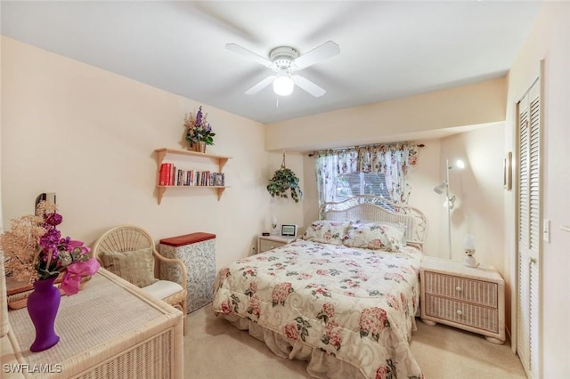 bedroom with a closet, a ceiling fan, and carpet floors