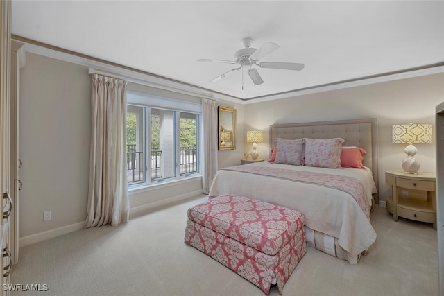 carpeted bedroom featuring ornamental molding, ceiling fan, and baseboards