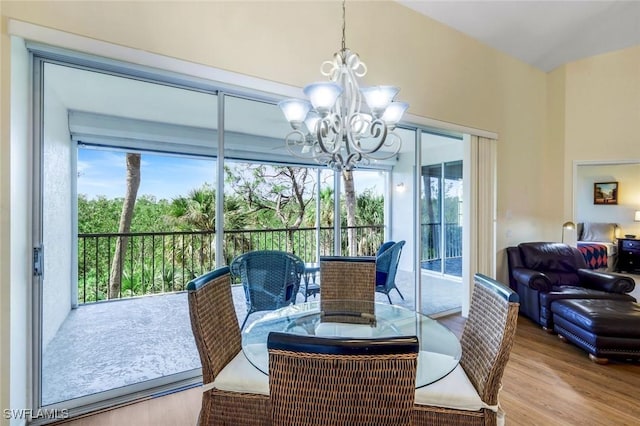 dining room with an inviting chandelier and wood finished floors