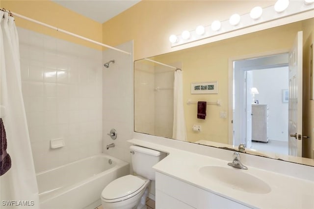 bathroom featuring vanity, toilet, and shower / bath combo with shower curtain