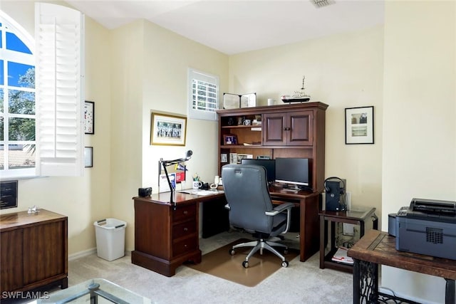 office featuring light carpet and visible vents