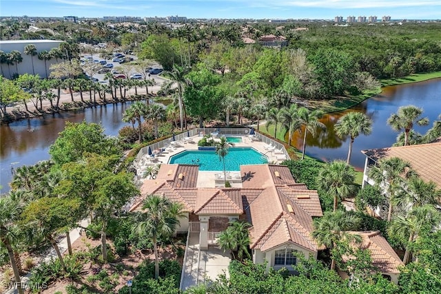 community pool featuring a water view and a patio