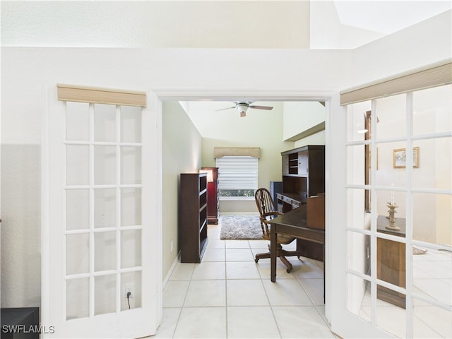 tiled office space featuring ceiling fan