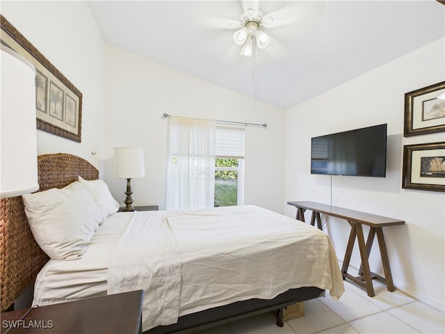 tiled bedroom with lofted ceiling and ceiling fan