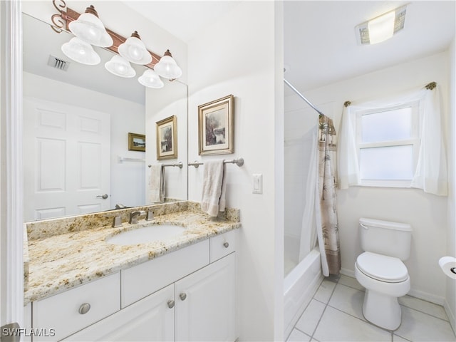 bathroom with toilet, visible vents, baseboards, vanity, and tile patterned floors