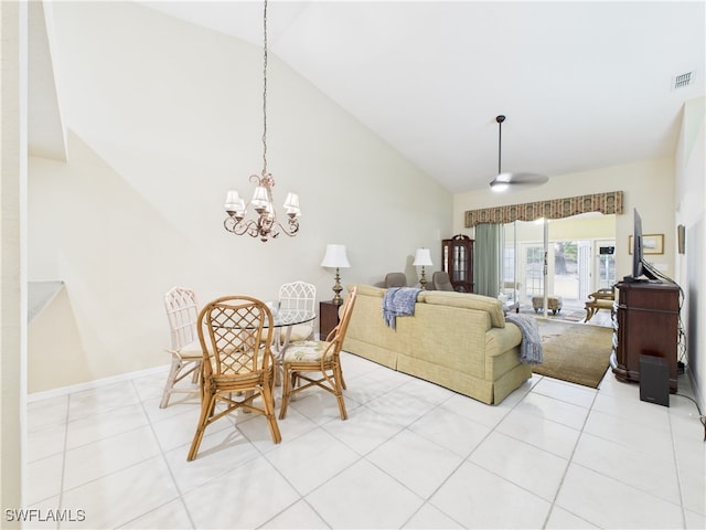 dining area with light tile patterned floors, visible vents, high vaulted ceiling, and an inviting chandelier