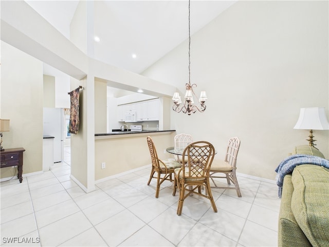 dining area featuring high vaulted ceiling, baseboards, light tile patterned flooring, and a notable chandelier