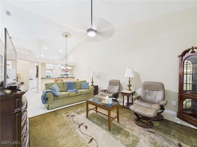 living room with baseboards, tile patterned floors, visible vents, and an inviting chandelier