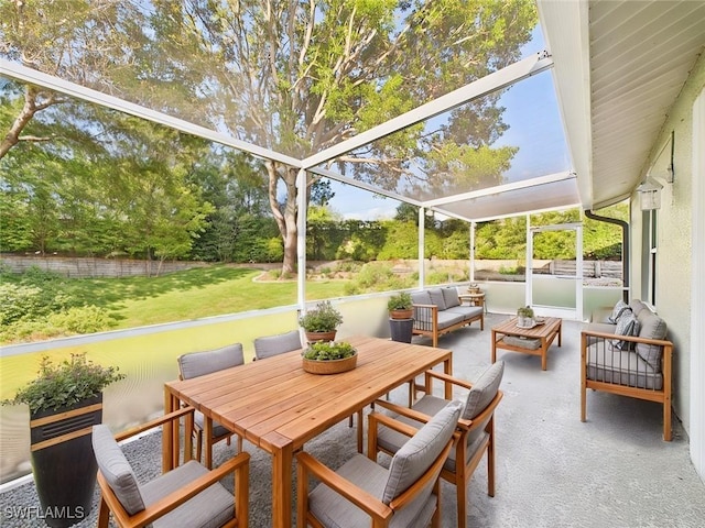 sunroom featuring outdoor lounge area