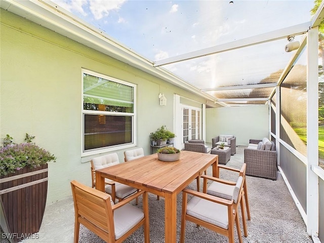 balcony featuring an outdoor living space, a patio area, french doors, and outdoor dining space
