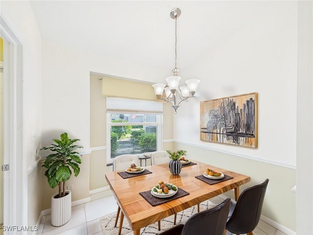dining room with baseboards, light tile patterned flooring, and a notable chandelier