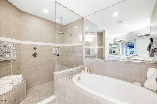 16445 Carrara Way Unit 201, Naples, FL 34110 - bathroom with a bath, a walk in shower, and recessed lighting