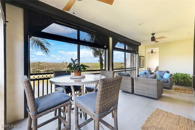 16445 Carrara Way Unit 201, Naples, FL 34110 - sunroom / solarium featuring a ceiling fan and an outdoor hangout area