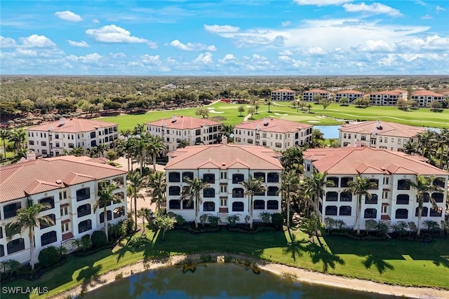 16445 Carrara Way Unit 201, Naples, FL 34110 - bird's eye view of a golf course, a nearby body of water, and apartment complex / building