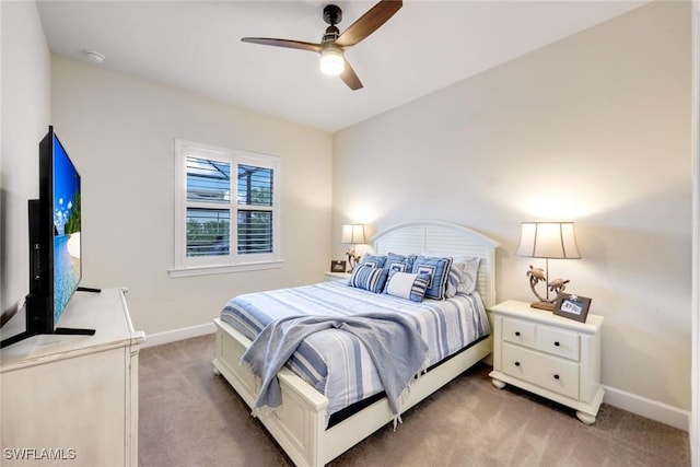 9151 Snowy Owl Way, Naples, FL 34120 - bedroom with light colored carpet, a ceiling fan, and baseboards