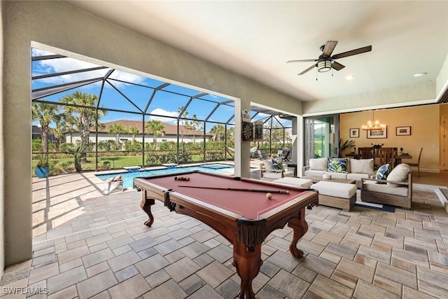 playroom with pool table, ceiling fan, and stone finish flooring