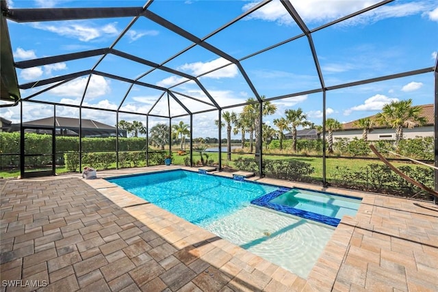 view of pool featuring a lanai, a patio area, and a pool with connected hot tub