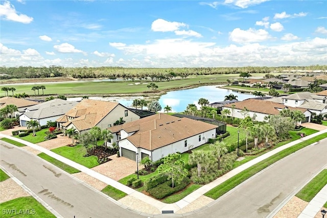 aerial view featuring a residential view and a water view