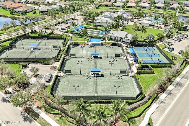 birds eye view of property featuring a water view and a residential view