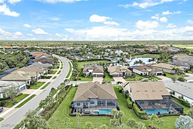 aerial view with a water view and a residential view