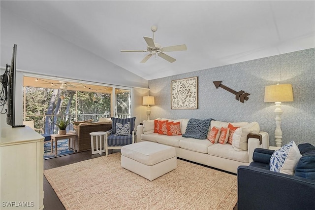 living area featuring a sunroom, vaulted ceiling, ceiling fan, wood finished floors, and wallpapered walls